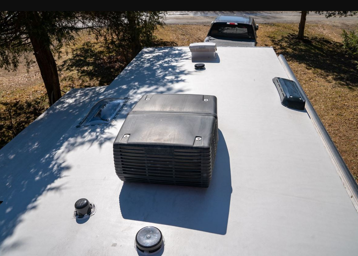 Rooftop RV air conditioning unit being serviced in Stuart FL